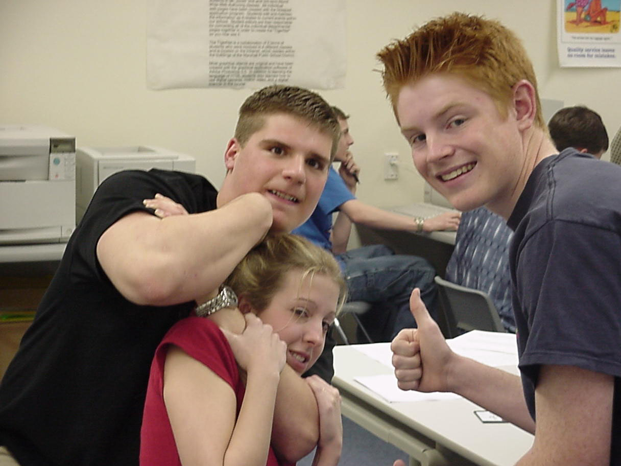 This is a picture of me and my friend Mitch.  He's the one chocking Brooke.  I am the crazy red head that is promoting the abuse.